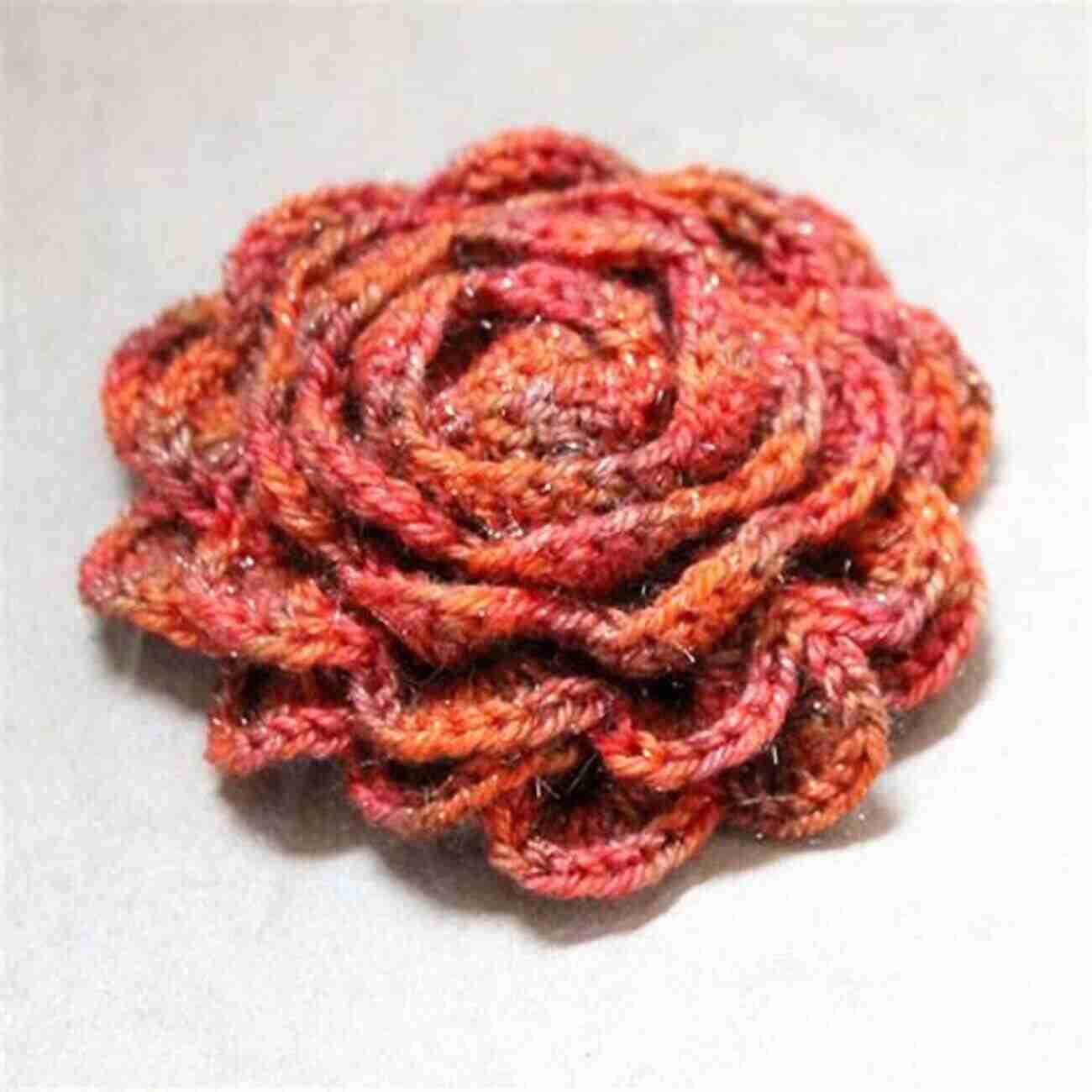 A Vibrant Crocheted Rose Brooch On A Denim Jacket Rose Crochet Tutorials: Creative And Beautiful Ideas To Crochet Rose