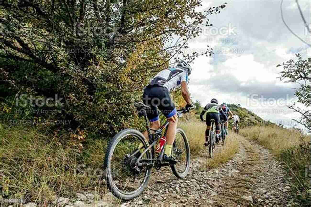 Cyclist Billy Dean Riding Uphill During Intense Training Training Tips For Cyclists Billy Dean