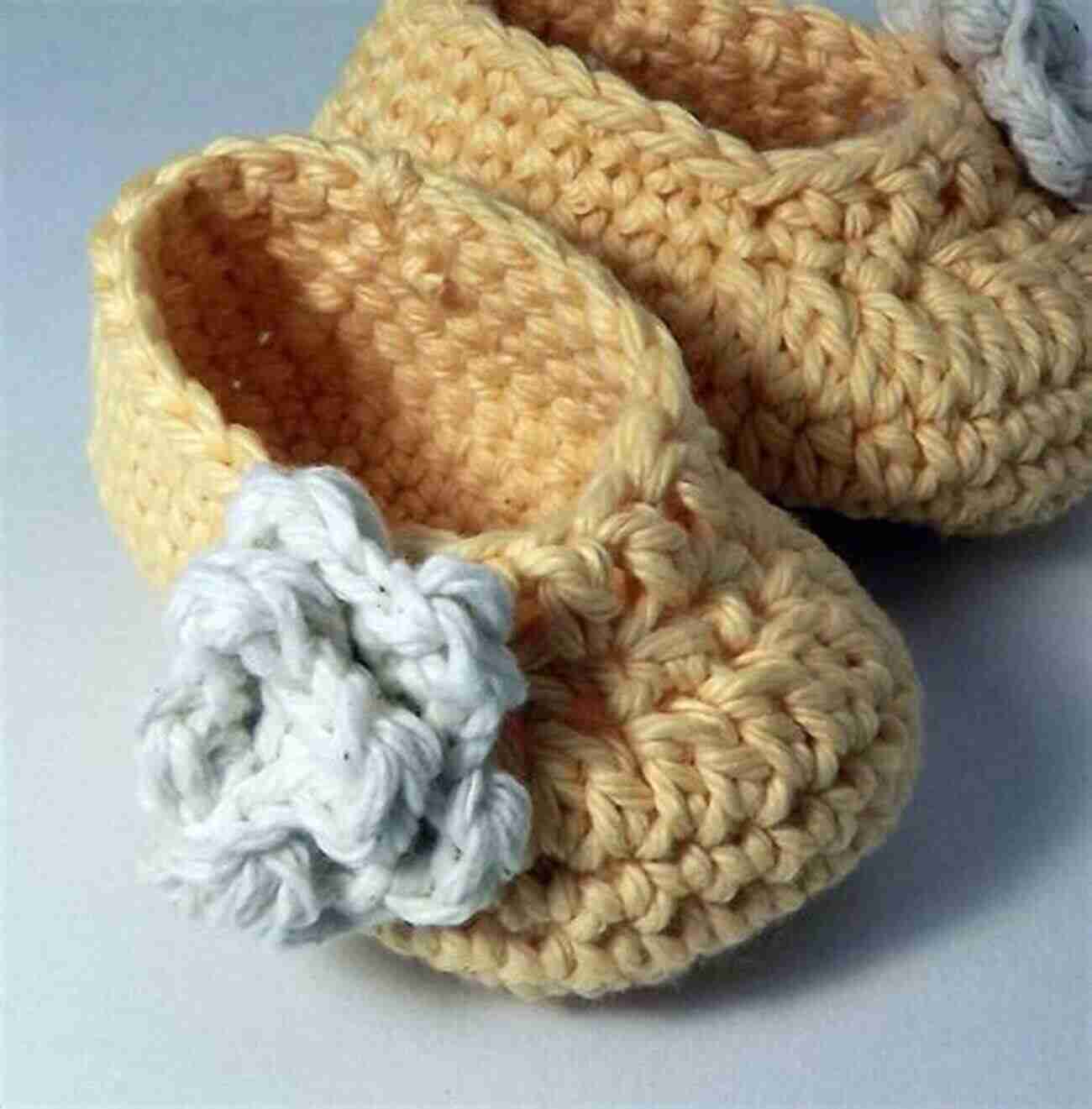 Enchanting Crocheted Rose Baby Booties On A Baby's Feet Rose Crochet Tutorials: Creative And Beautiful Ideas To Crochet Rose