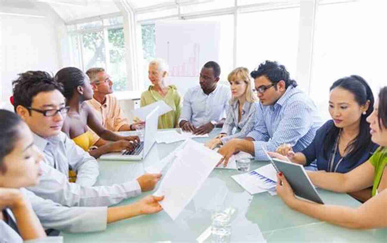 Government Employees Working Together In An Office Improving The Performance Of Government Employees: A Manager S Guide